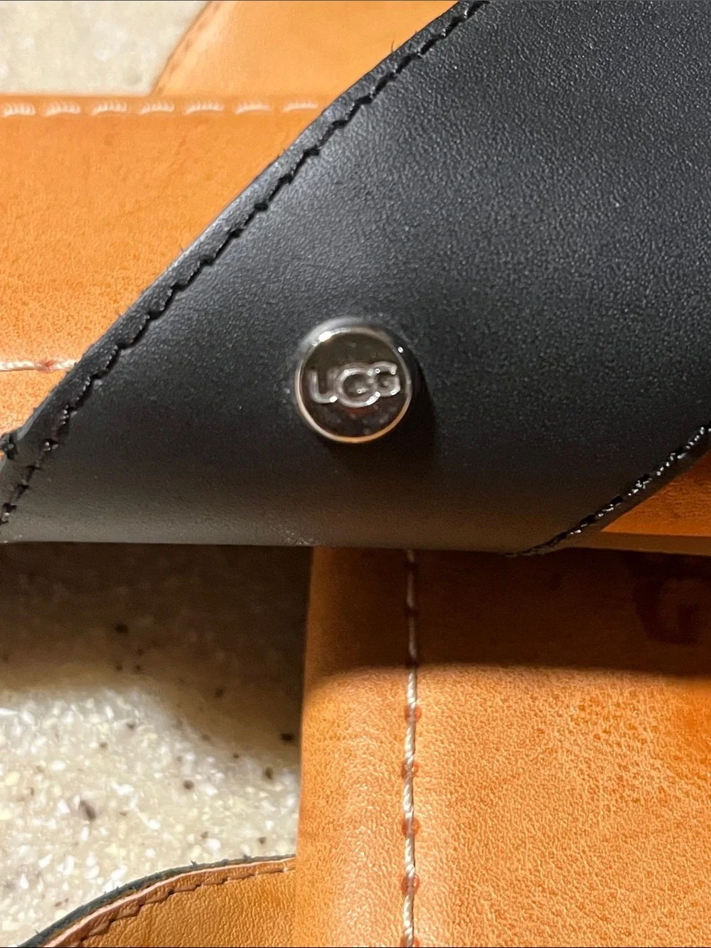 UGG Women’s Black and Tan Leather Toe-Post Sandals